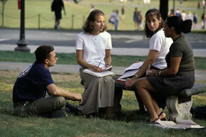 Students sitting near drillfield